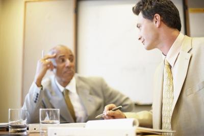 Shareholder and executive in meeting