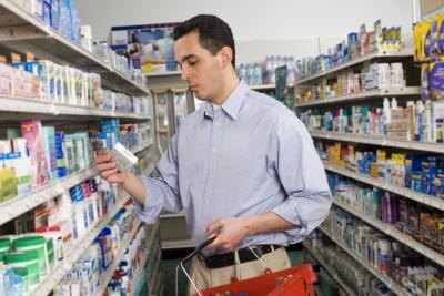 Man at pharmacy shopping for medication