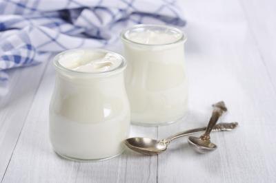 Feeding your dog yogurt periodically will help provide him essential nutrients.