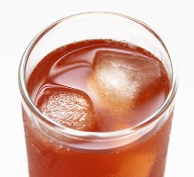 A glass of cranberry juice.
