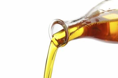 Corn oil pouring from bottle