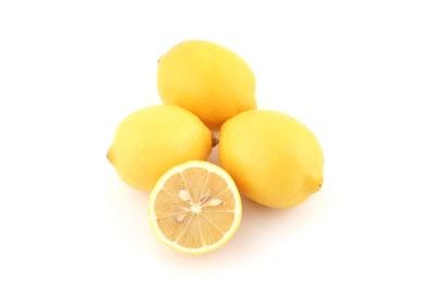 Whole lemons and a cut lemon.