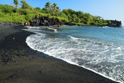 a black sand beach on Maui