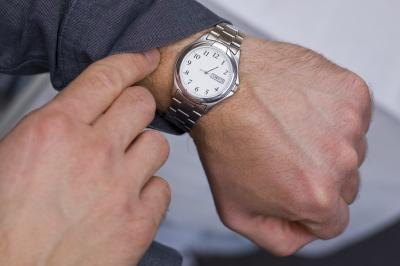 man looking at watch