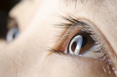 Close up of young boy's eyelid.