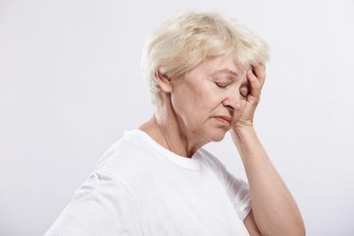 older woman feeling dizzy