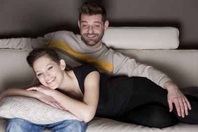You can always find a romantic movie on DVD and set aside a night to watch it together.