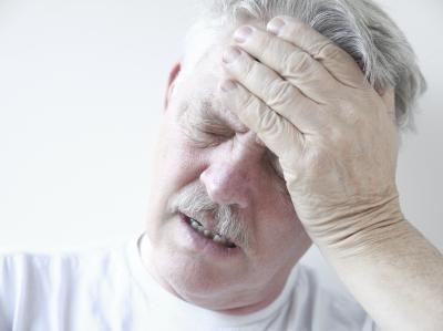 Man holding his head in pain.