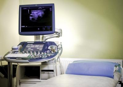 Medical equipment in empty hospital room.