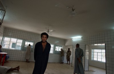 Male patients standing in room of psychiatric hospital