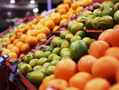 Citrus fruit section in grocery store.