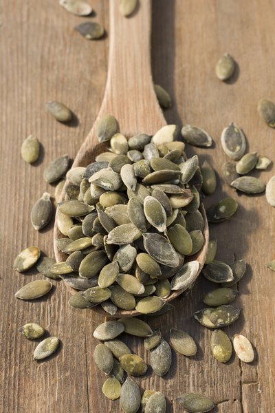 Roasted pumpkin seeds in spoon