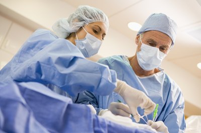 Doctors performing foot surgery