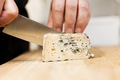 slicing blue cheese
