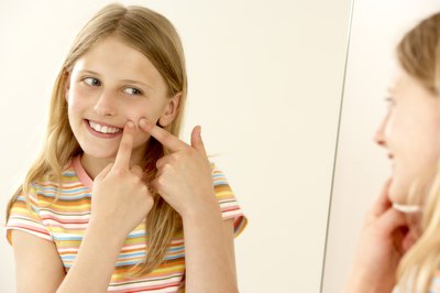 child popping pimple