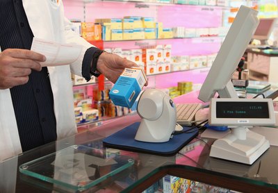 Pharmacist scans medication