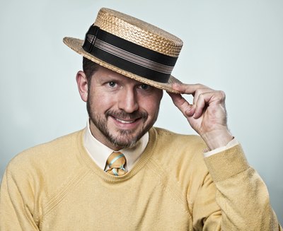 Man wearing a straw boater hat