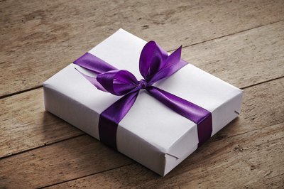 A wrapped gift on a wooden table