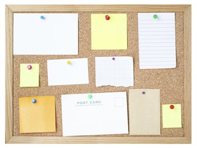 Common school glue adheres many materials to corkboard.