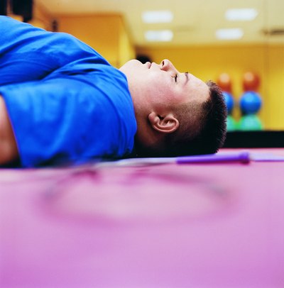Large tired man lying on the floor