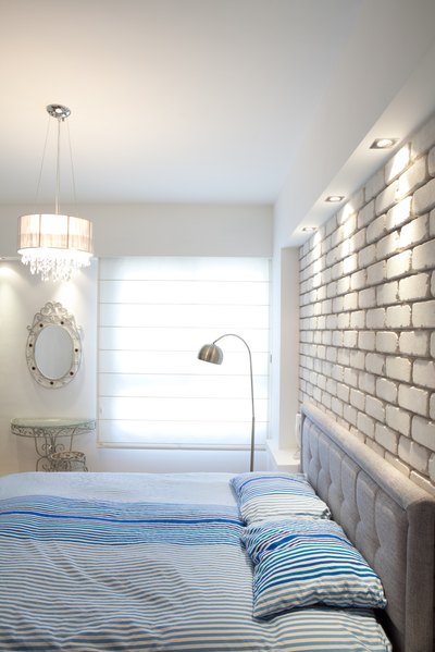 Large lamp next to bed