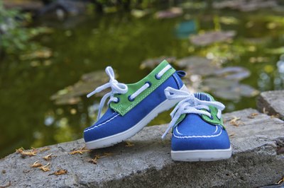 Boys shoes on rocks