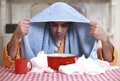 A man inhaling warm steam