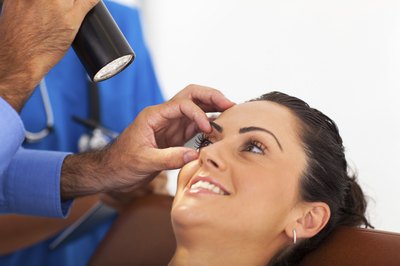 A doctor examining the eyes.