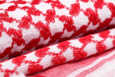 folded blankets with red and white