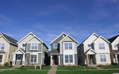 Rows of houses with gray roofs.