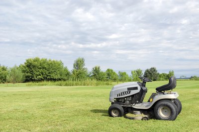 Lawn tractor parked in front of an open field