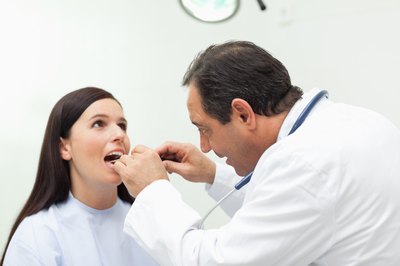 Woman getting mouth swab