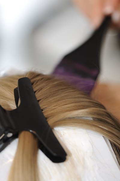 Use the clip to secure sections of hair.