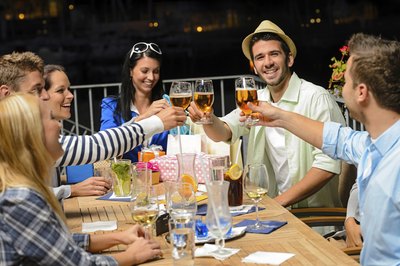 Group of friends celebrating at restaurant