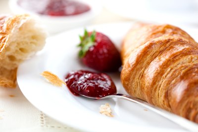 Croissant with fruit and jam