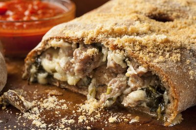 Homemade Italian Calzone with sausage and spinach