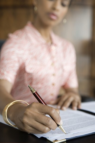 Businesswoman writing