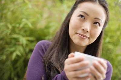 woman drinking from tea cup
