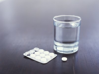 Drugs such as aspirin may cause bloody urine as a side effect.