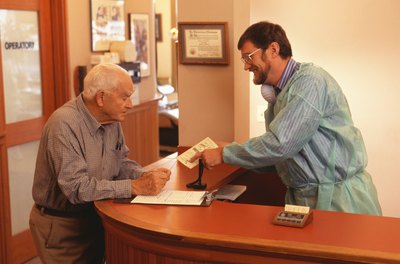 Dentist explaining cost to patient.