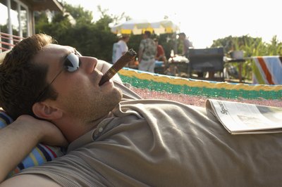 man smoking cigar outside