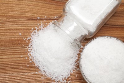 A shaker spilling salt.