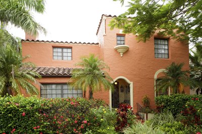 A Mediterranean style home with wood trim.