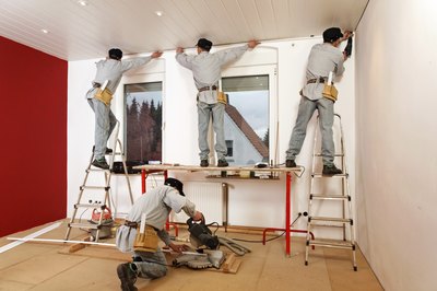 Repairmen working on home.