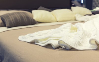 Blankets on a king-size bed.