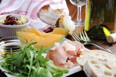 Rustic table setting with prosciutto