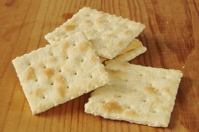 Saltine crackers on tabletop.