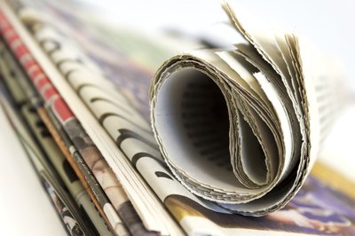 Rolled up newspaper on top of stack