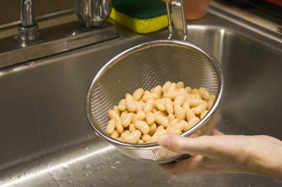 Cannellini beans rinsed in strainer