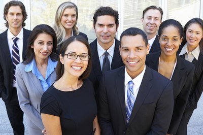 A portrait of a group of diverse employees in an office.